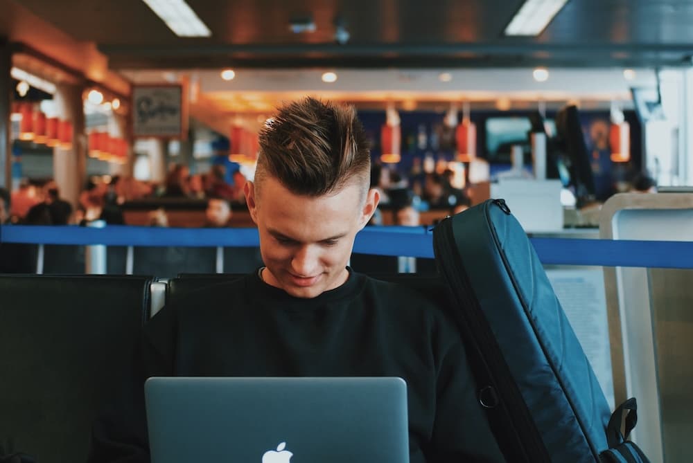 Young businessman working in airport